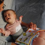 Mom Reading to Baby