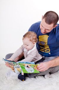Dad Reading With Baby